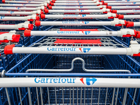 Bucharest, Romania 05.01.2021: Shopping carts belonging to Carrefour Hypermarket. Logo of the French retailer Carrefour