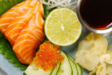 sashimi set, Japanese food. sushi restoran menu. Japanese seafood. sashimi set on plate with cucumber and salad. Takea way sashimi set.