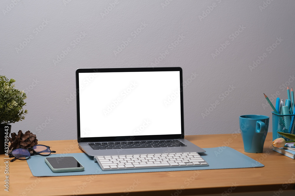 Poster front view of office desk with write display computer and cup of coffee