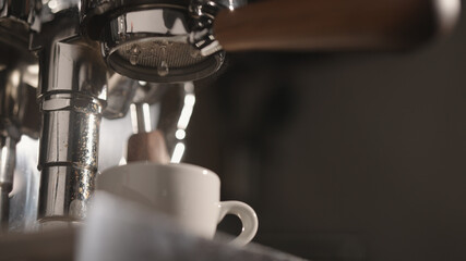 closeup of rinsing espresso coffee machine in the morning