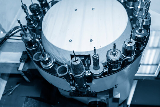 The solid end mill tool in the tooling magazine of machining center. The automatic tool change ,ATC operation concept on the CNC milling machine.