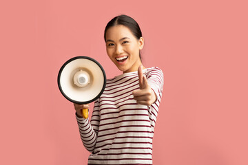 Cheerful Asian Woman With Megaphone Making Announcement And Pointing At Camera