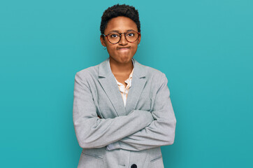 Young african american woman wearing business clothes skeptic and nervous, disapproving expression...