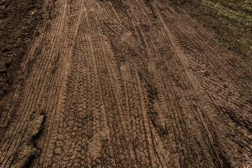 Sierkussen Wheel track on mud for background © surawach5