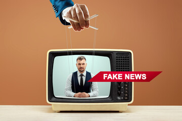 The puppeteer's male hand manipulates the news announcer, fake news, deception. The concept of...