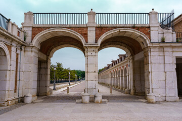 Arches and entrance doors to the royal palace of Aranjuez in Madrid.