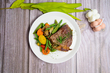 grilled beef steak and vegetables