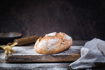 Fresh homemade crisp bread on wooden background. French bread. Bread at leaven. Unleavened bread