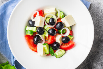 fresh greek salad vegetable, olives, tomato, cucumber, olive oil traditional recipe organic dish on the table healthy food meal snack copy space food background rustic. top view keto or paleo diet