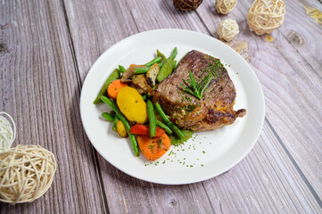 grilled beef steak and vegetables