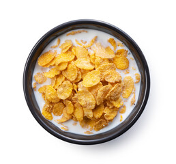 Milk and cornflakes in a black bowl