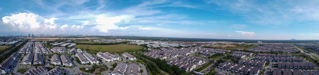Fototapeta na wymiar Aerial panorama view of the housing area with beautiful blue sky in background