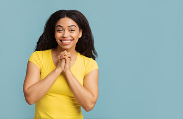 Please concept. Pretty african american woman making pleading gesture, clasped hands and begging...