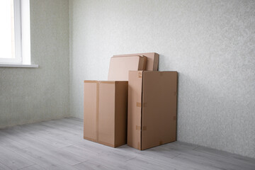 Brand new selection of furniture in cardboard boxes just arrived in new home