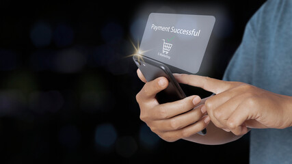 Man holding smartphone with online shopping payment successful.