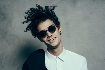 emotional guy with curly hair teen classic suit sunglasses shirt model