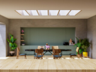 Wood table top on blur kitchen counter.