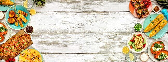 Summer BBQ grill double border over a white wood banner background. Chicken and shrimp skewers,...