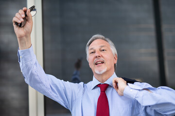 Businessman raising his finger to call a taxi outdoor
