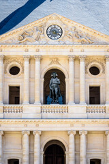 Fototapeta premium Front view of the southern facade of the court of honor of the Hotel des Invalides in Paris, France, with the statue of Napoleon Bonaparte on the balcony.
