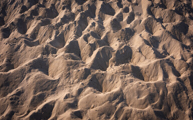 Abstract geometry of footprints over sand dune on Cape Cod beach