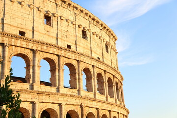 Obraz premium Arches of the Roman Colosseum at sunset. Italy