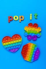 Toy pop it. Poppit is a new fidget toy, popular among children and people with special needs. On a blue background