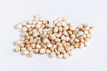 Uncooked quinoa macro image close-up. isolated on a white background