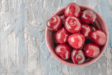 closeup ripe cherry fruits in a bowl on table