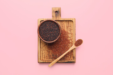 Bowl and spoon with healthy quinoa on color background