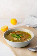 Bowl of tasty lentil soup on table