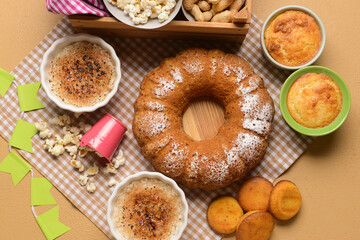 Traditional food for Festa Junina (June Festival) on color background