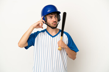 Young caucasian man playing baseball isolated on white background having doubts and thinking