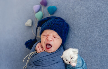 Newborn sleeping with kitten © tan4ikk
