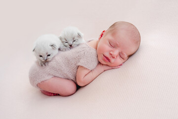 Newborn sleeping with kittens © tan4ikk