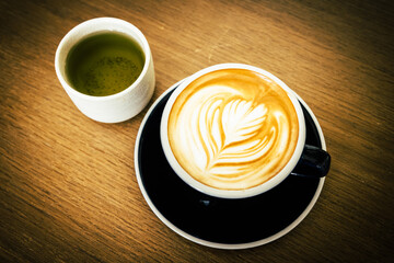 Coffee cup and beans on old vintage table. Top view with copy space for your text into the background.	
