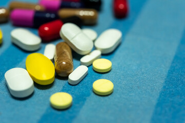 Pharmaceutical medicine pills in both tablets and capsules with the vintage retro picture style. Pharmacy theme and treatment medication as concept.	
