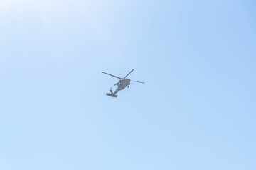 Military helicopter on blue background.