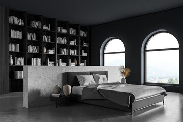 Dark bedroom interior, bed with linens and bookshelf with arched window © ImageFlow