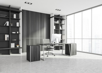 Luxury CEO office corner with table, computer and bookcase, dark
