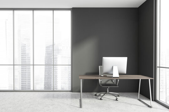 Concrete and gray CEO office with computer desk and window