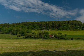 Fototapeta na wymiar Meadows and fields between Vacov and Ckyne towns in Sumava mountains