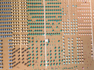 Italy June 2021, aerial view of beach umbrellas on the Romagna Riviera