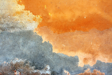 Old stucco wall texture of orange and grey colors