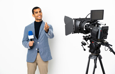 Reporter African American man holding a microphone and reporting news over isolated white...