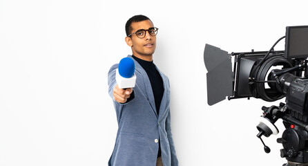 Reporter African American man holding a microphone and reporting news over isolated white background
