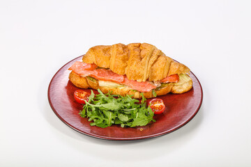 Croissant with salmon for breakfast