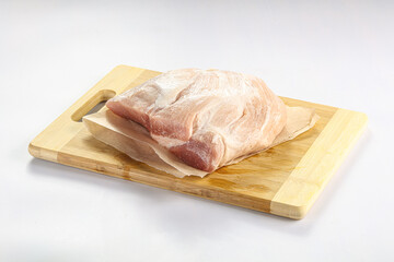 Raw pork fillet over board