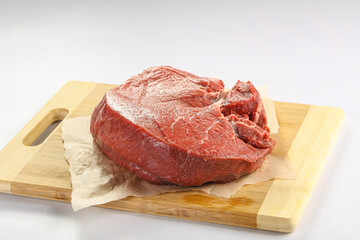 Raw beef meat over board