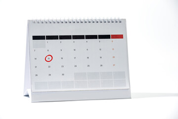 Red circle marked on calendar sheet. Mark on the calendar at 16. Date of calendar with red circle.